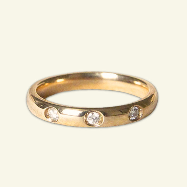 The Court Shape Wedding Band with Three Diamonds