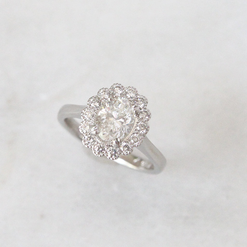 Vintage Style 0.91 Carat Oval Shaped Diamond Halo Cluster