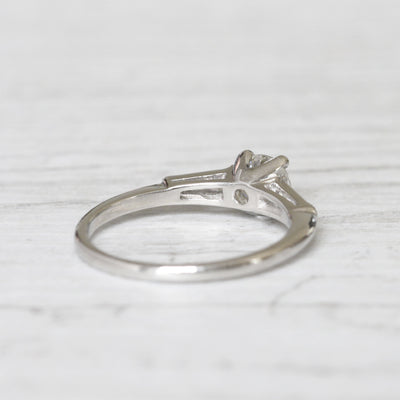 Vintage 0.65 Carat Brilliant Cut and Tapered Baguette Cut Diamond Solitaire